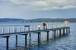 Photograph of people walking on a jetty in Albany