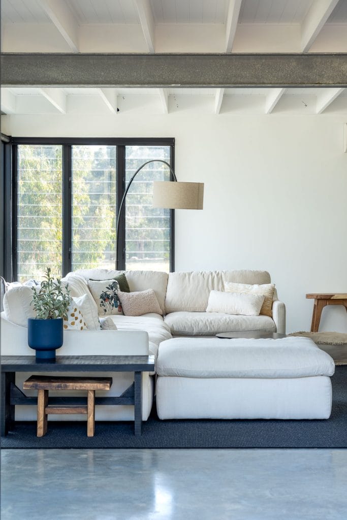 Photo of a white sofa and blue coffee table