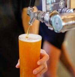 Photo of a beer being poured from a tap