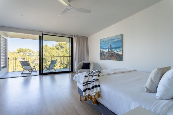 Photo of Novella master bedroom with balcony