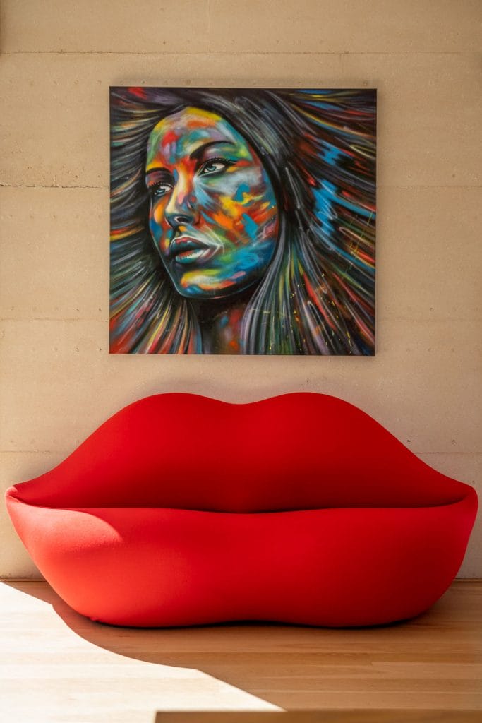 Photo of colourful artwork and sofa